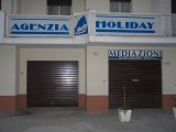 Allestimento insegna Agenzia Immobiliare Holiday